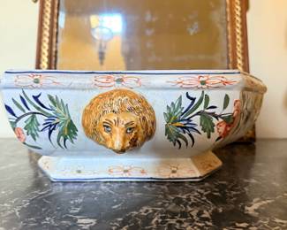 French-Style Hand-Painted Faience Jardinière with Lion-Mask Decoration — Decorative glazed ceramic planter featuring colorful floral and foliate motifs, raised lion-mask ornament, shaped rim, and pedestal base. Traditional French provincial design.