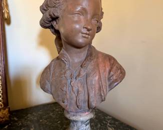Classical European-Style Terracotta-Finish Portrait Bust on Marble Pedestal — Finely detailed sculptural bust depicting a youthful 18th-century aristocratic figure with elaborate curled hairstyle and period clothing. Warm reddish-brown finish mounted on a decorative gray-and-white veined marble socle. French Rococo/Louis XVI-inspired styling.