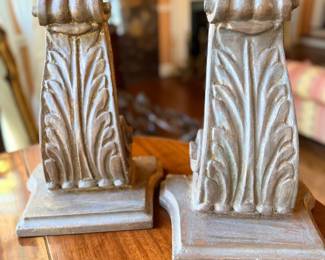 Suggested Inventory Description Pair of Neoclassical-Style Architectural Acanthus Leaf Corbels / Decorative Bookends — Attractive matching pair featuring classical acanthus leaf relief, scroll-form upper details, and stepped rectangular bases. Finished in a distressed silver-gray metallic patina. Ideal for bookshelves, mantels, or traditional interior décor. Sold as a pair.
