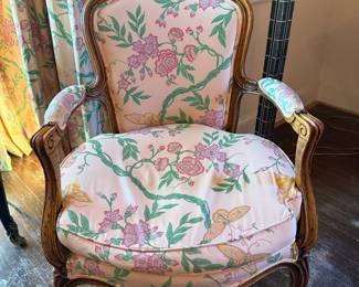 Vintage French Provincial style bergère (armchair) with a fruitwood finish and custom pink Chinoiserie floral upholstery