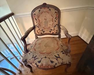 French Louis XV–style carved walnut armchair (fauteuil) with needlepoint or tapestry upholstery