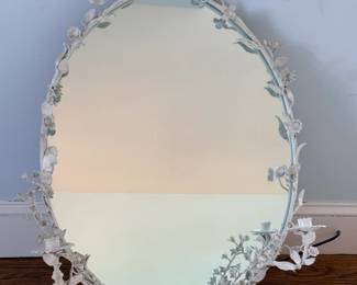 vintage Italian-style tole floral mirror with integrated candle sconces, sometimes called a toleware girandole mirror