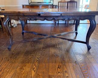 French Provincial style Louis XV draw-leaf dining table with a striking parquetry inlaid top