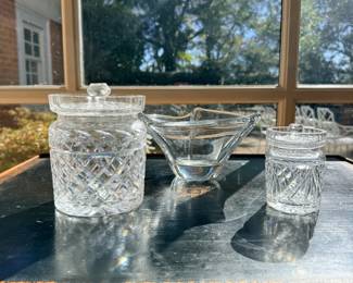 Collection of Three Vintage Crystal and Art Glass Pieces — Includes a large diamond-cut crystal covered jar, a smaller matching-style crystal covered jar, and a sculptural clear art glass bowl with an asymmetrical rim. Attractive decorative glassware suitable for display or entertaining. Pieces sold individually.