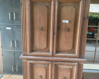 Vintage Entertainment Center That Has Been Used on Covered Patio