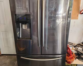 Samsung Black Stainless Steel 3 door, French door refrigerator. Ice and water does not work but can be fixed. $300.