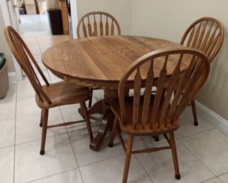 Round oak pedestal table and 4 chairs
