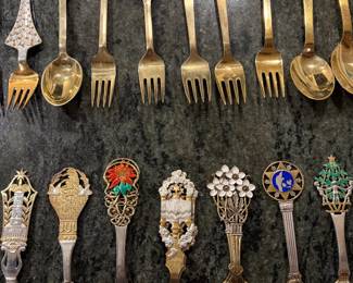 Anton Michelson Gilded Sterling Silver and enameled Danish Christmas forks and spoons Dating from 1910 to 1987 total of 90 pieces.
