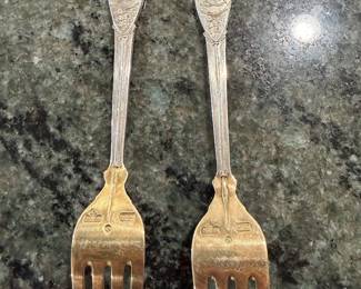 Anton Michelson Gilded Sterling Silver and enameled Danish Christmas forks and spoons Dating from 1910 to 1987 total of 90 pieces.