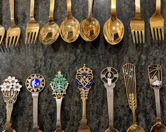 Anton Michelson Gilded Sterling Silver and enameled Danish Christmas forks and spoons Dating from 1910 to 1987 total of 90 pieces.