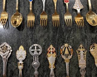 Anton Michelson Gilded Sterling Silver and enameled Danish Christmas forks and spoons Dating from 1910 to 1987 total of 90 pieces.
