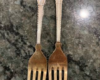 Anton Michelson Gilded Sterling Silver and enameled Danish Christmas forks and spoons Dating from 1910 to 1987 total of 90 pieces.