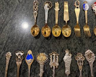 Anton Michelson Gilded Sterling Silver and enameled Danish Christmas forks and spoons Dating from 1910 to 1987 total of 90 pieces.