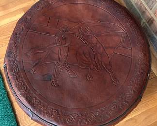 Spanish-style tooled leather footstool or hassock, featuring an embossed bullfighting scene