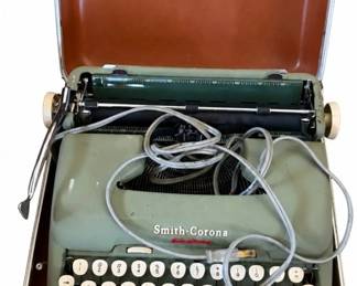Smith-Corona electric typewriter – green portable with carrying case | Lot 1141, bids start at $10