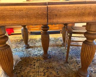 two leaves stored under the table, then pop out when table is expanded