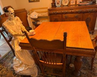 Square golden pork dining table, with two pop-up leaves; carved oak Edwardian sideboard; oak press-back chairs with good cane seats