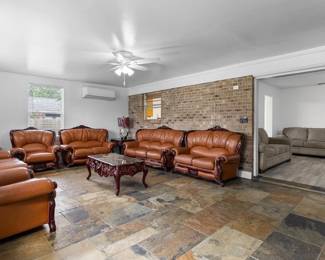 Vintage style new leather couch sets (2 sets are shown and can each be sold separately). 2 loveseats + 2 sofas + 2 chairs including tables and lamps. Ask for separate selling options.