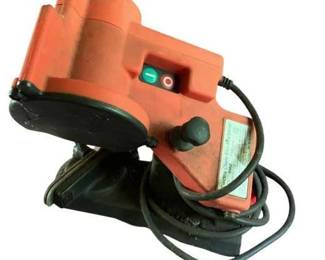 329 - Electric Chain Saw Sharpener (Description): bolted to table, will need tools to remove Used as is electric/electronic/mechanical item. No guarantee all components, untested.