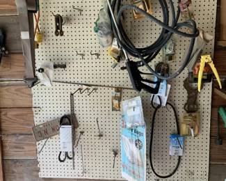 311 - Assorted Items on pegboard