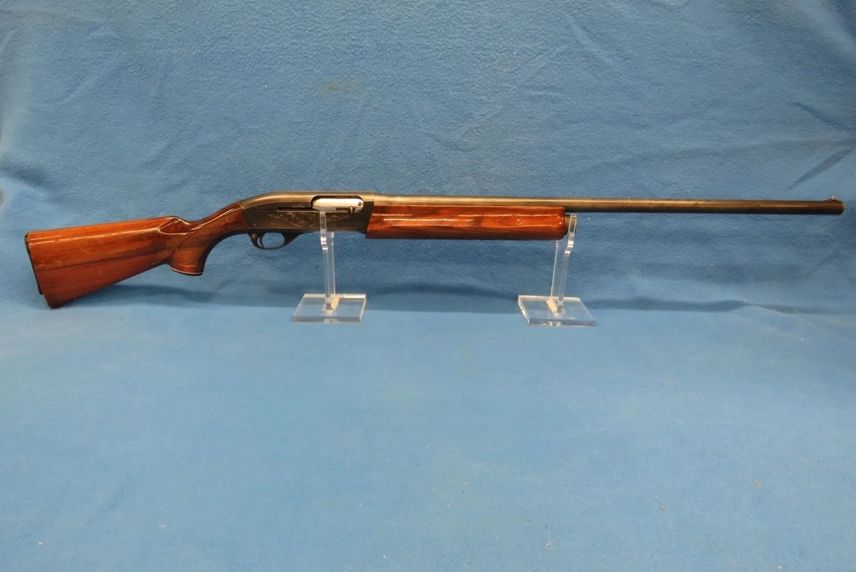 Lot 11. Remington 1100 semi-auto 12-gauge shotgun. S/N L689033V. 28" barrel with a 2 3/4" chamber. No choke listed.
