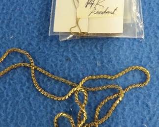 Lot 84. Prior owner described it as a 14k pendant and a 925 silver necklace