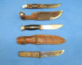 Lot 93. Three fixed-blade knives. A Western with missing leather washers, a J. A. Hellburg, and an unbranded one.