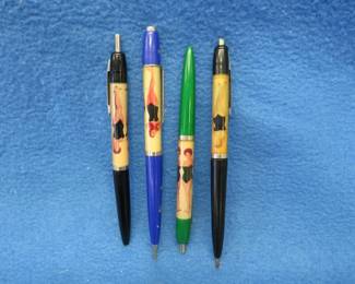 Lot 424. Four novelty pens with disappearing swimsuits