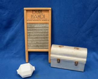 Lot 233. Lightning rod ball, the ends are chipped, wash-board, and a lunchbox with a "thermos"