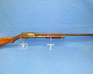 Lot 12. Browning Ranger 12-gauge pump shotgun. S/N 92485. 30-inch barrel with no choke listed. Includes a case.