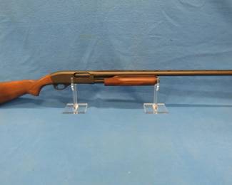 Lot 214. Remington 870 Express 12-gauge pump shotgun. S/N X231823M. 28" vent-rib barrel with a 3" chamber. Includes a. case.