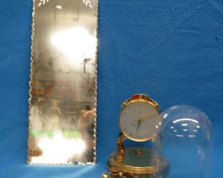 Lot 337. Anniversary clock and a decorative mirror