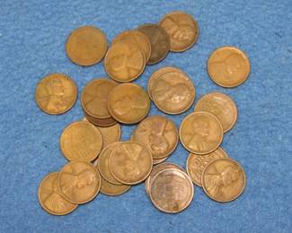 Lot 69. 27 well-circulated Lincoln Wheat pennies. Dates range from 1915-1925.