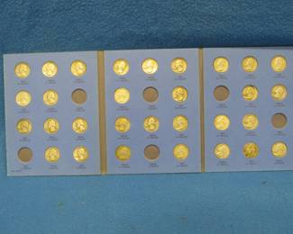 Lot 64. 30 silver Washington quarters in a Whitman folder