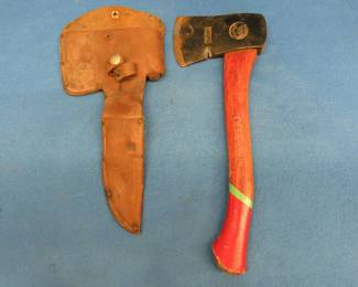 Lot 390. Official Boy Scout hatchet and leather ax and knife combined sheath. No knife. Snap missing on the sheath.