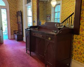 A beautiful, large antique (1800-1820) Sheraton style sideboard at entrance. 6'1 x 2'2 x 3'11 . Gorgeous 7'x5' antique beveled rectangular mirror. Would be marvelous standing vertically too!