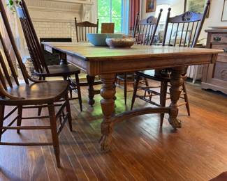 Clawfoot dining room table is 5'9" x 3'8". Shown in pictures with 2 leaves in, there are 5 leaves total. Each leaf adds an additional foot to the table