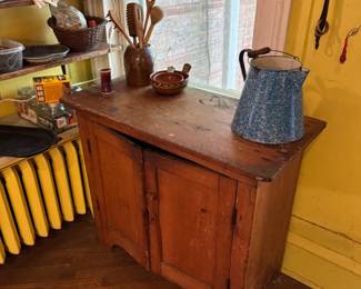 This is the sweetest old jelly cabinet! It has a heart shaped knot on top !