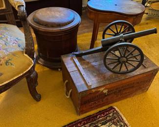1941 toy cannon, antique wheeled wooden commode and wooden bidet on right!