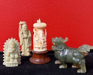 Hand carved soapstone, intricately carved bone Ganesha, carved jade Foo Dog.