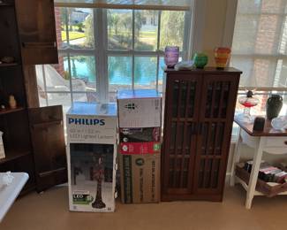 a Christmas tree, a Christmas post and a storage cabinet