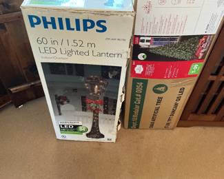 Lighted Christmas lantern and lighted Christmas tree