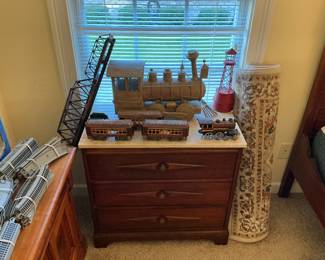 Large metal Train, another marble top nightstand.