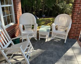 Wicker rockers and a wooden rocker