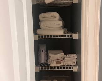 Assortment of all white towels, and sheets