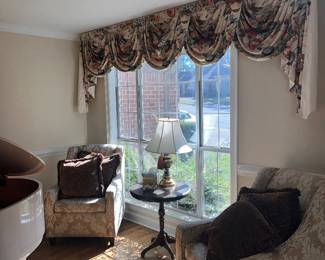 Matching accent chairs with solid wood end table and lamp.