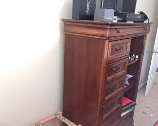 Chest of drawers. Luggage caddy. Tv