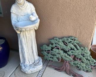 A Plaster Cast Monk Birdbath and a Tree of Life