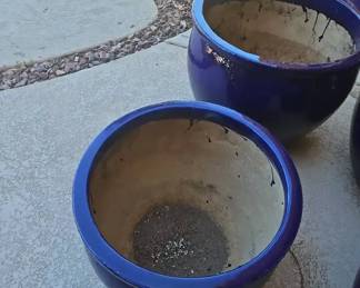 A Very Large Round Blue Stone Planter and a Medium Matching One