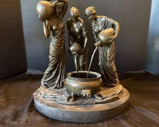 A Bronze of Three Maidens Pouring Water into a Cauldron